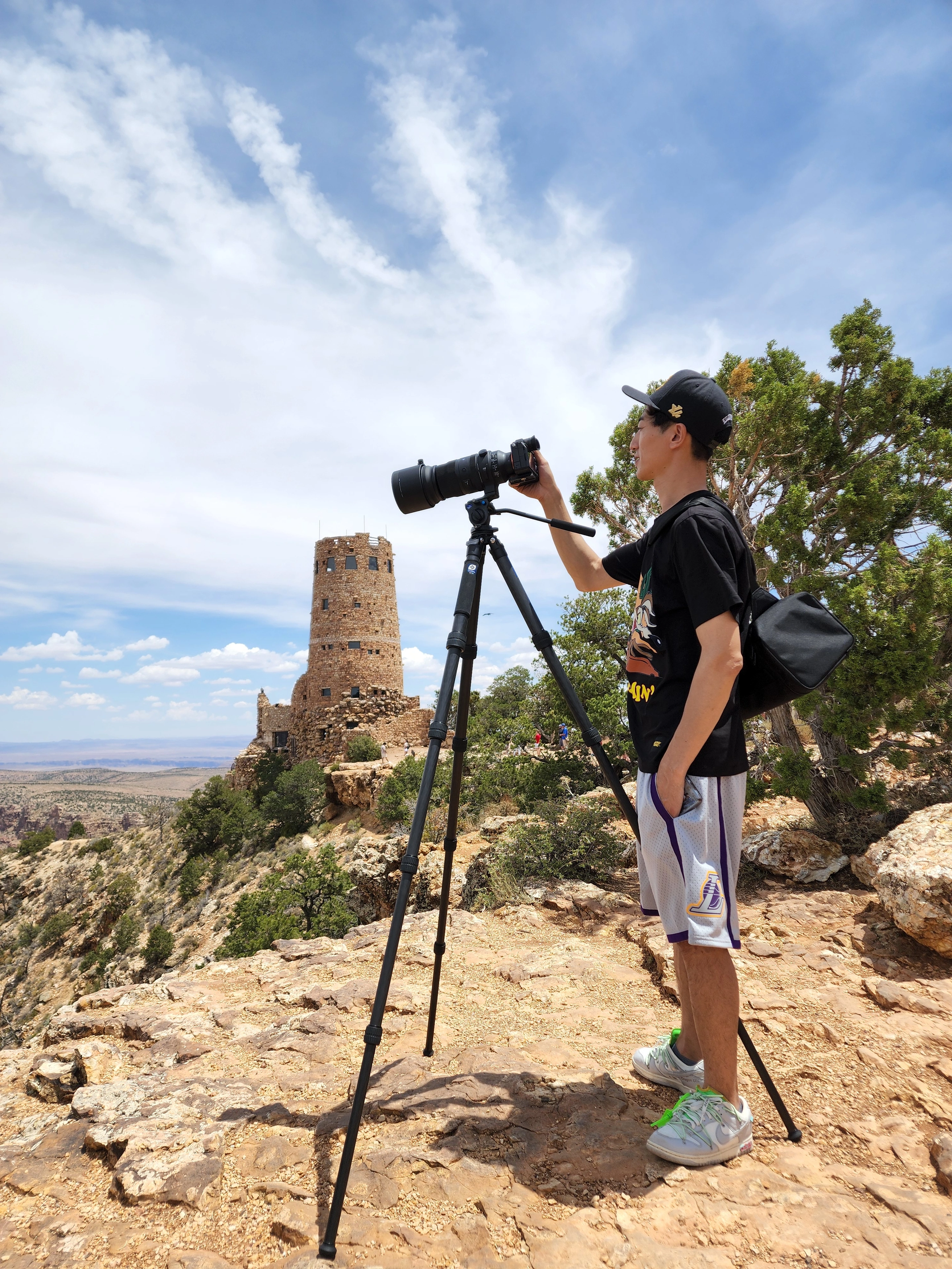 David working with a camera on a tripod at a canyon overlook
