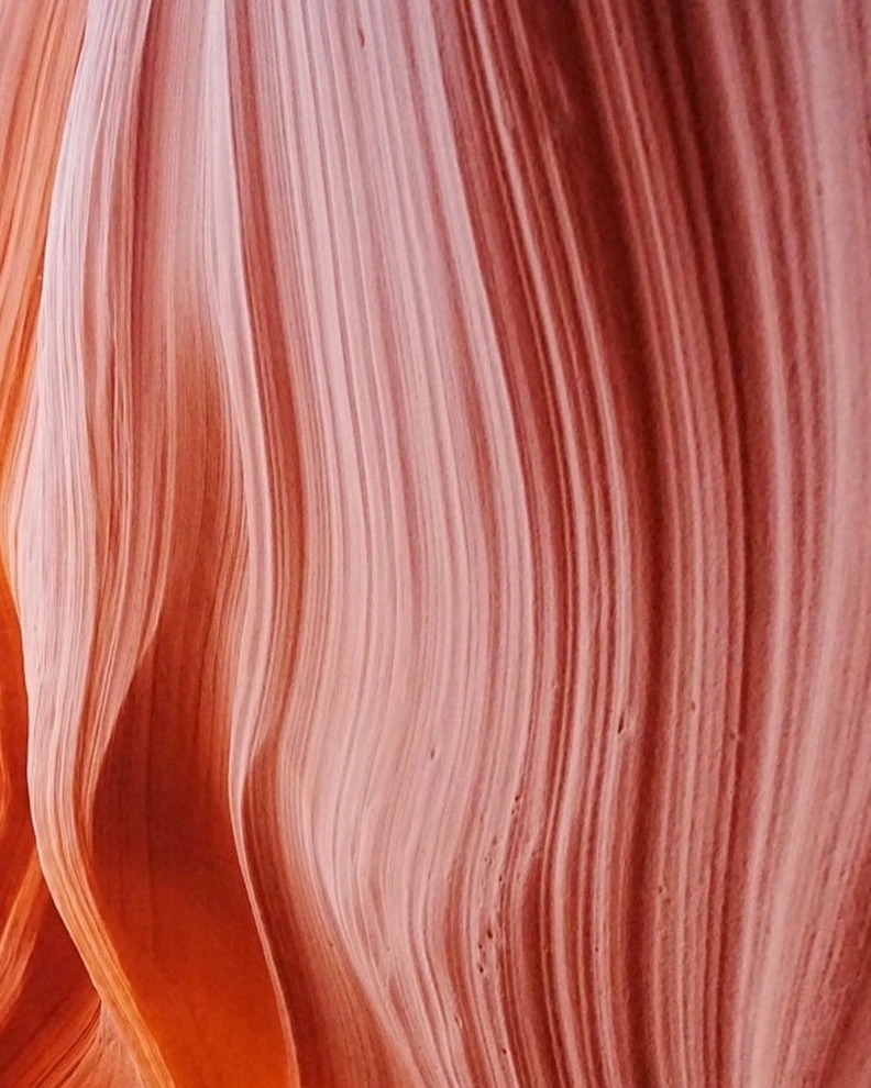 Flowing orange sandstone lines inside Antelope Canyon