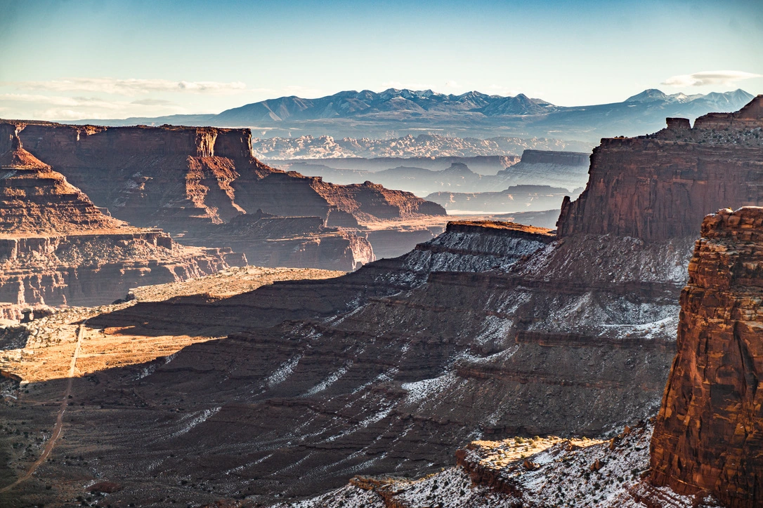 Layered desert mesas touched by winter snow