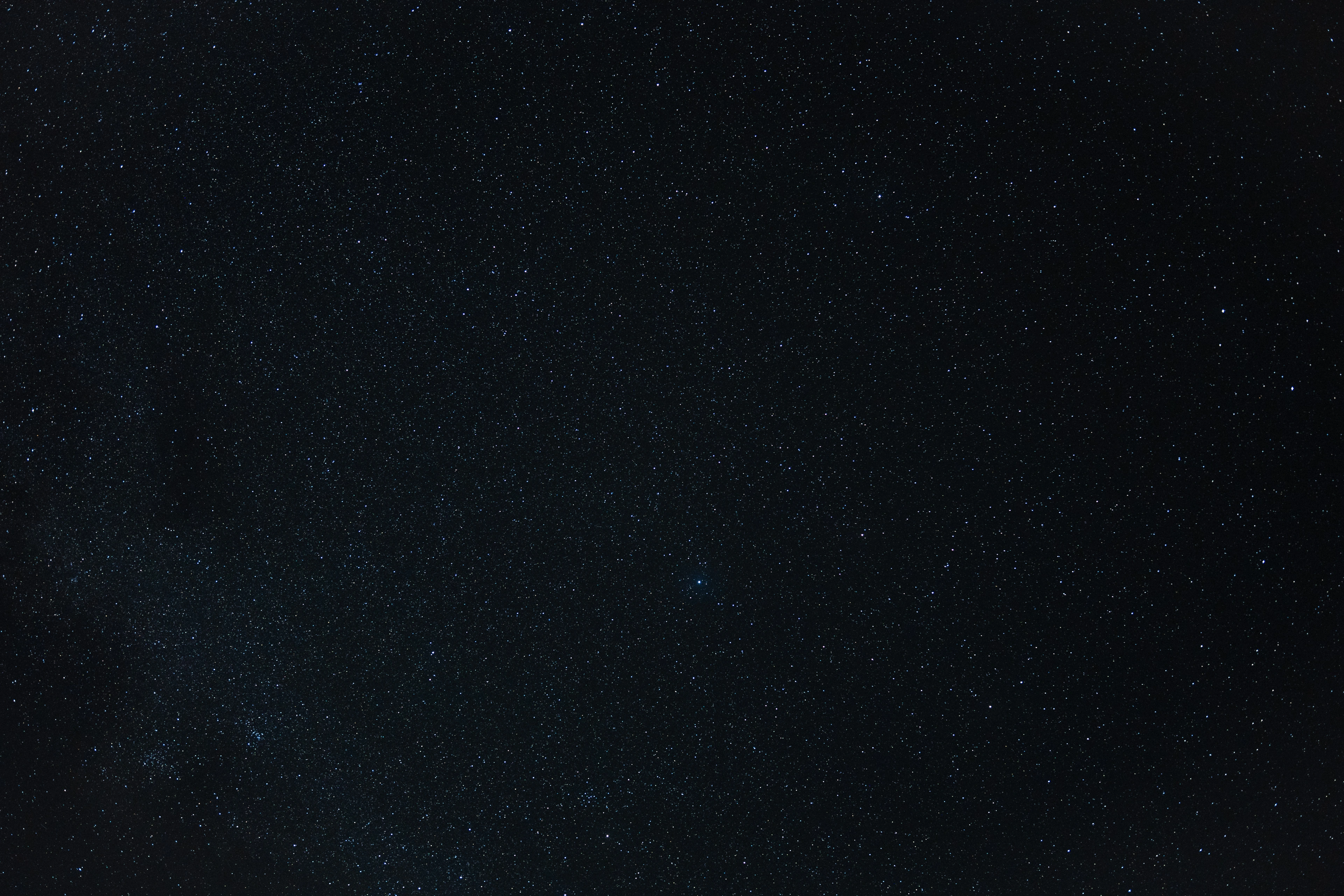 A wide star field above Waimea Canyon