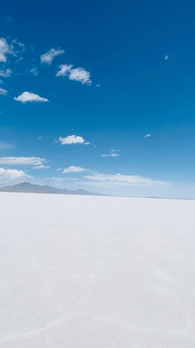 A vertical view of blue sky above the white Bonneville Salt Flats
